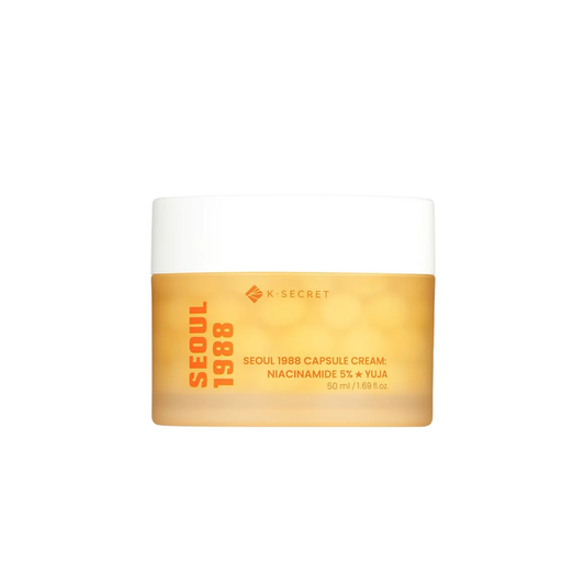 KSECRET SEOUL 1988 Capsule Cream : Niacinamide 5% + Yuja is a nourishing moisturizer designed to brighten, hydrate, and improve the appearance of dull, uneven skin. Formulated with 5% Niacinamide and Yuja, it helps promote a clearer, more radiant complexion, while Magnesium Ascorbyl Phosphate provides additional brightening and antioxidant care. Multiple forms of Hyaluronic Acid, Squalane, Shea Butter, and Jojoba Oil help replenish moisture and leave skin soft and plump. Adenosine and Collagen Water support