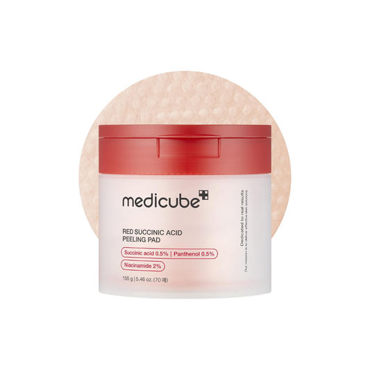 MEDICUBE Red Succinic Acid Peeling Pad is a daily exfoliating pad that helps smooth, clarify, and brighten the skin. Infused with Succinic Acid and Salicylic Acid, it gently removes dead skin cells, clears clogged pores, and reduces excess oil without over-drying. Enriched with Niacinamide and Panthenol, it brightens dull skin while keeping it hydrated and calm. Botanical oils like Peppermint, Rosemary, and Bergamot refresh the skin and leave a clean, revitalized finish.