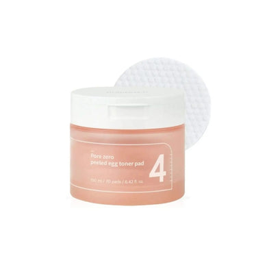 NUMBUZIN No. 4 Pore Zero Peeled Egg Toner Pad is designed to refine pores and smooth skin texture for a clear, flawless complexion. Infused with Gluconolactone (PHA) and Capryloyl Salicylic Acid (LHA), these pads gently exfoliate dead skin cells, unclog pores, and promote a brighter, more even skin tone. Enriched with hydrating ingredients like Sodium Hyaluronate, Panthenol, and Betaine, they ensure your skin stays moisturized and balanced. The added botanical extracts, including Evening Primrose and Pine L