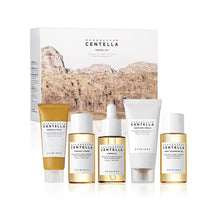 Load image into Gallery viewer, SKIN1004 Madagascar Centella Travel Kit is a convenient set designed for on-the-go skincare. It includes miniature versions of the brand&#39;s popular products, all formulated with Centella Asiatica Extract to soothe and heal the skin. This travel-friendly kit is perfect for maintaining a healthy skincare routine while traveling, providing essential hydration and protection to keep your skin refreshed and revitalized, no matter where you are.