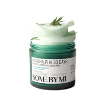 Load image into Gallery viewer, SOME BY MI AHA-BHA-PHA 30 Days Miracle Truecica Clear Pad is a gentle exfoliating pad designed to clear pores and improve skin texture. Formulated with 85% Willow Bark Water and Betaine Salicylate, it effectively removes dead skin cells and excess oil while soothing the skin with Centella Asiatica and Tea Tree extracts. The addition of multiple soothing ingredients like Houttuynia Cordata and Madecassoside makes it ideal for sensitive skin, helping to calm irritation and maintain a healthy, clear complexion